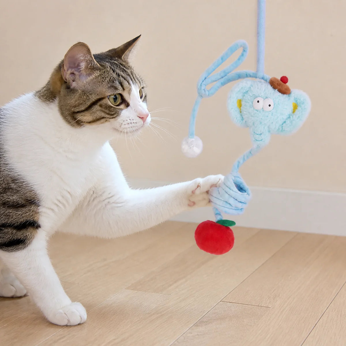 Bungee Elephant Hanging Cat Toy in a bright pet-home setting